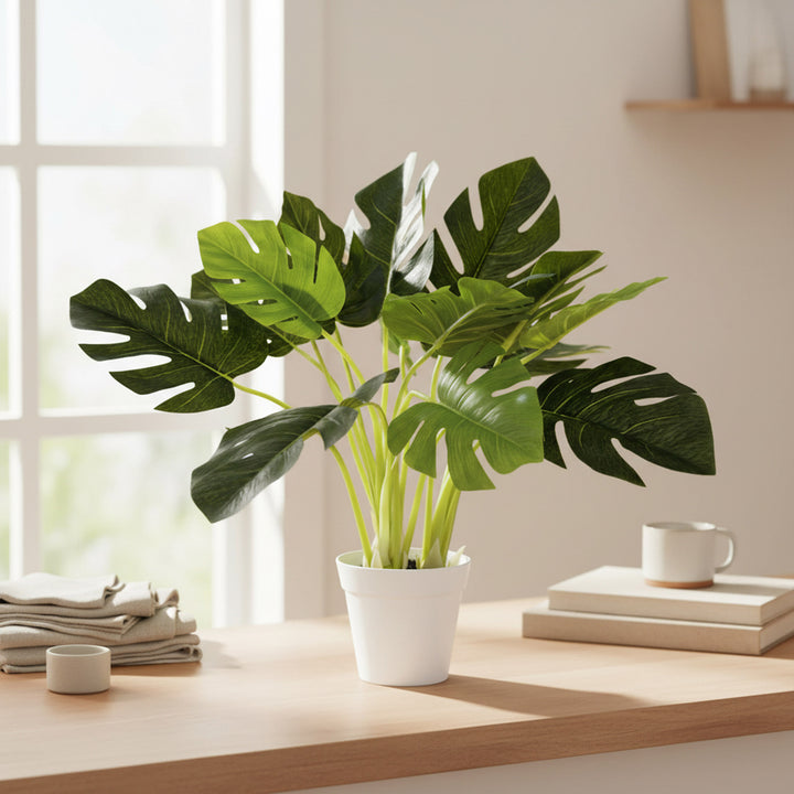 19 inch faux monstera in white decorative planter with lifelike split leaves